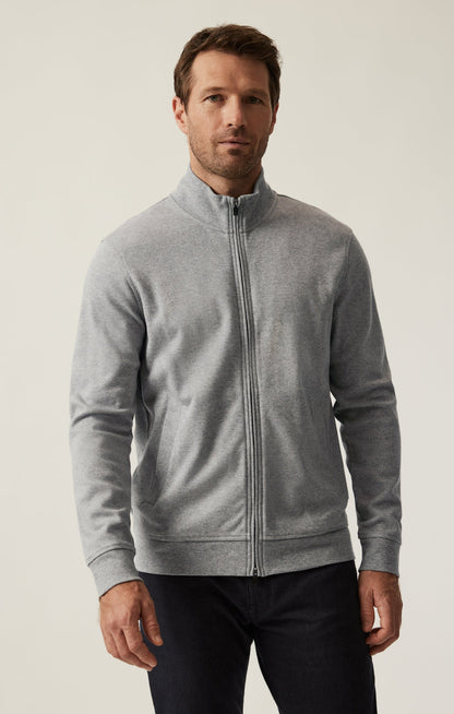 A male model wearing a gray high neck zip-up sweatshirt with Pima cotton fabric.